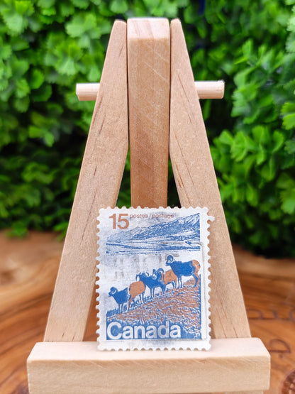 Collection of 65 mixed foreign postage stamps from different countries around the world.