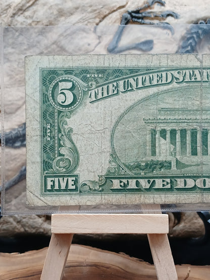 5 American dollars . 1953